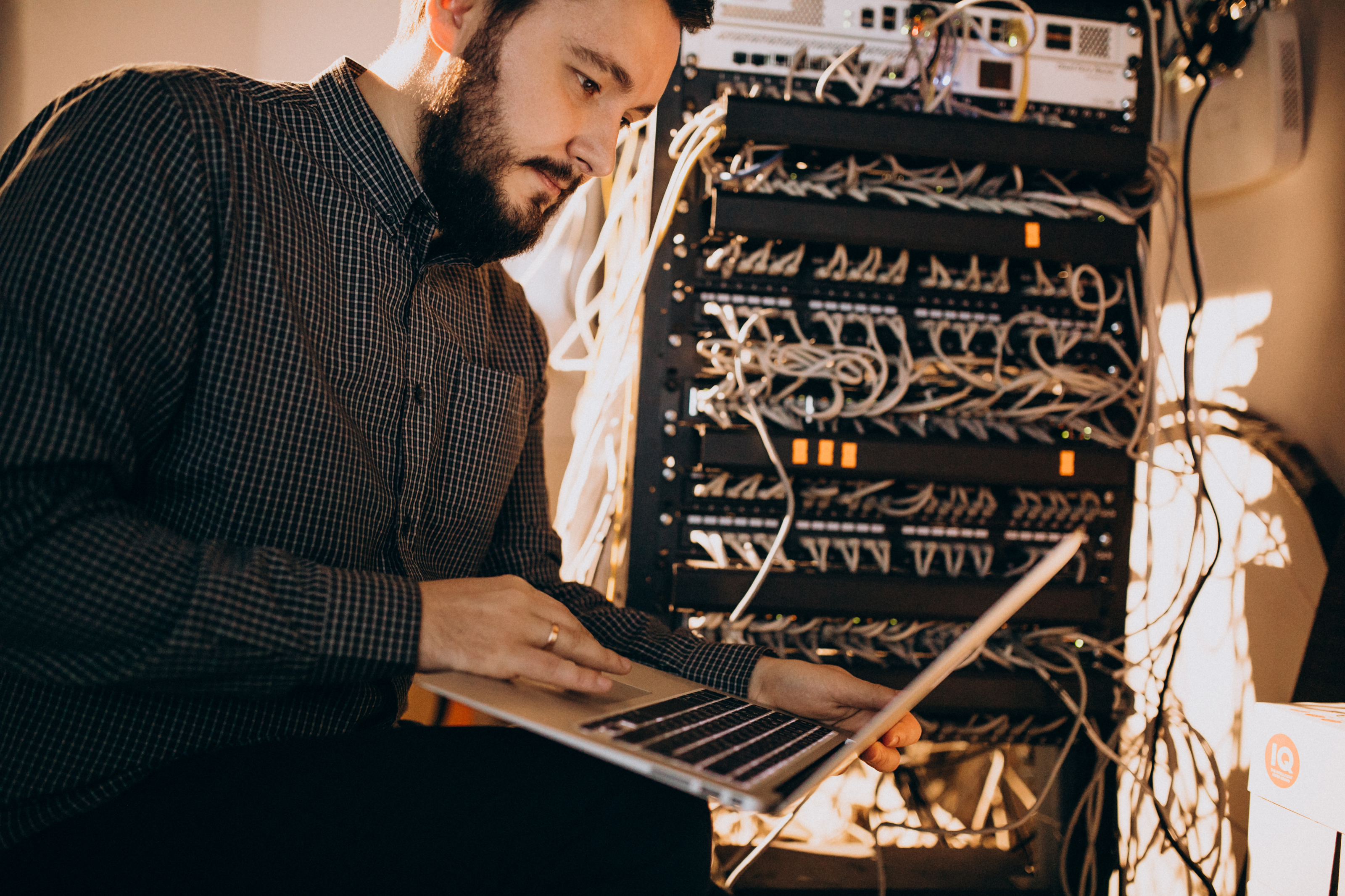 CSOC Analyst man repairing computer